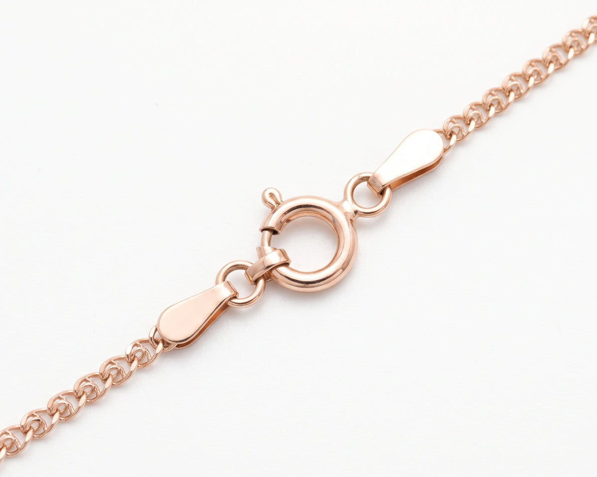 Close-up of a Gold Vermeil Heart Chain Necklace showing the lobster clasp and tag details on a clean white background.