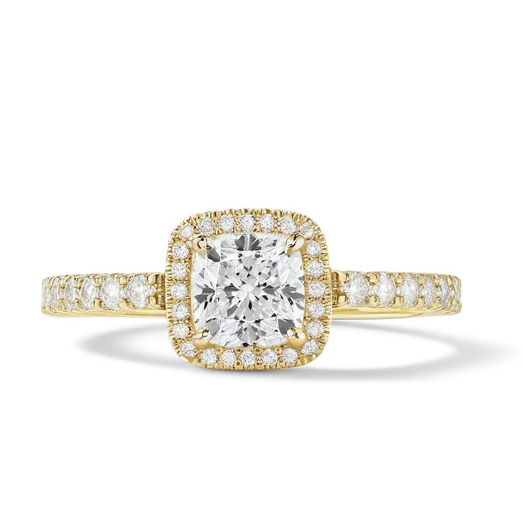 The Cushion Cut Moissanite Ring showcases a cushion cut moissanite center, haloed by smaller gems and accented with stones along the band—crafted in Sterling Silver 925, its an elegant option for promise rings.