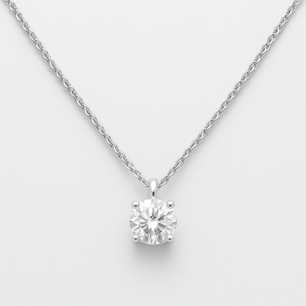 Dainty sterling silver moissanite necklace on a light gray background