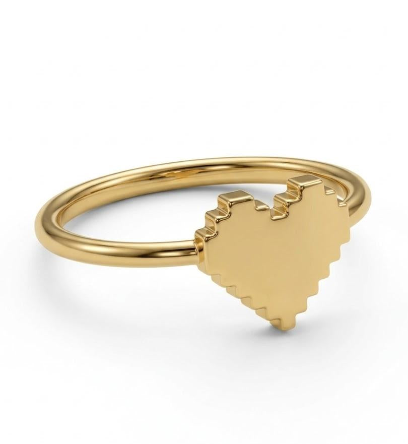Gold-plated ring with a heart-shaped design on a white background