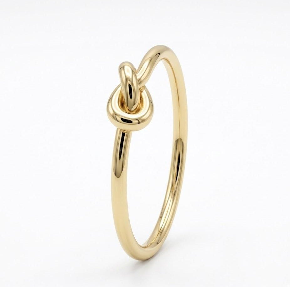 Gold-plated sterling silver knot ring on a white background