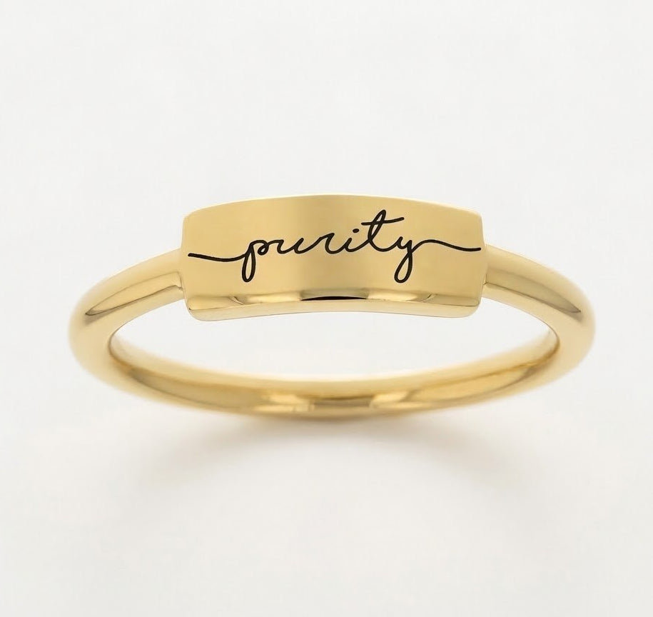 Silver gold-plated ring with 'purity' engraving on a white background - front view