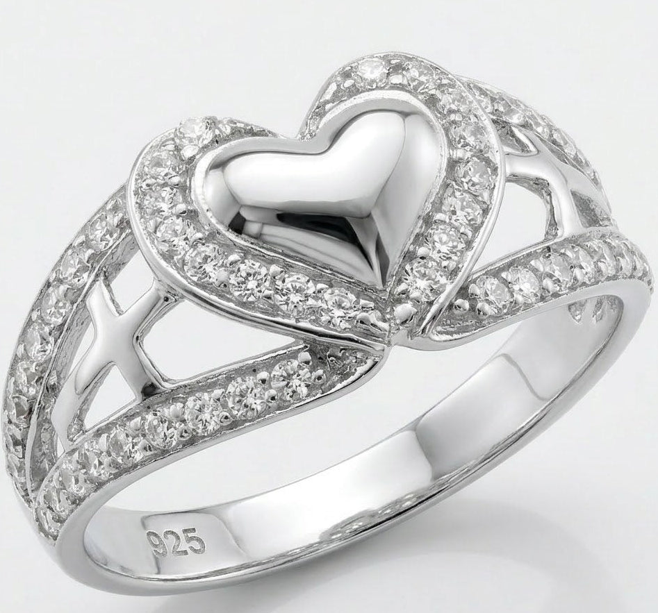 Silver heart-shaped ring with CZ on a white background