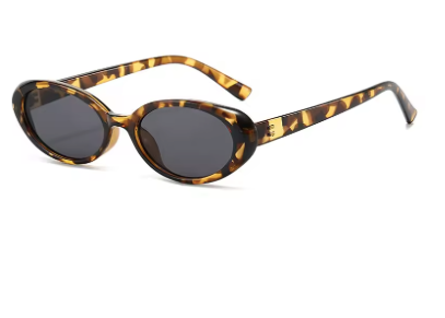 Sunglasses with tortoiseshell frame and dark lenses on a white background