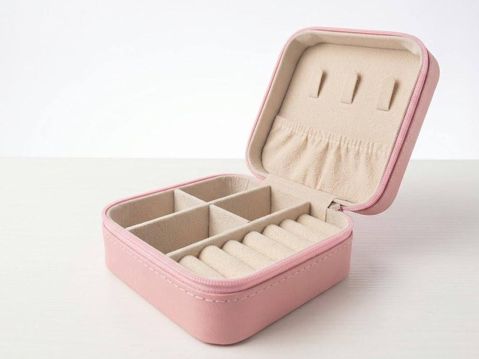 open Pink jewelry box on a white background
