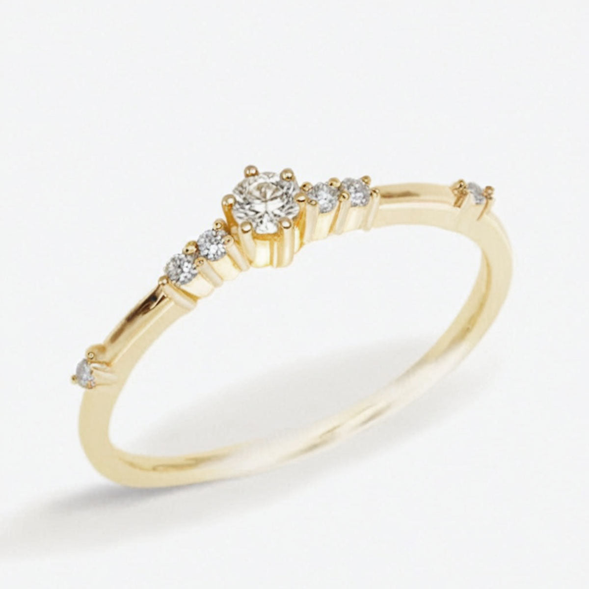 moissanite promise ring in 14K gold on white background side view