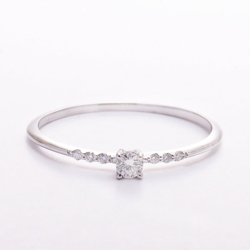 Minimalist 14K gold promise ring on white background