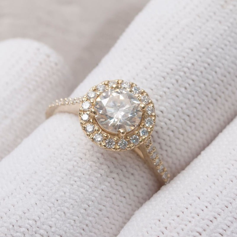 1-Carat Moissanite Diamond Ring with 1ct moissanite center and 36 white diamonds on a 14K gold band.