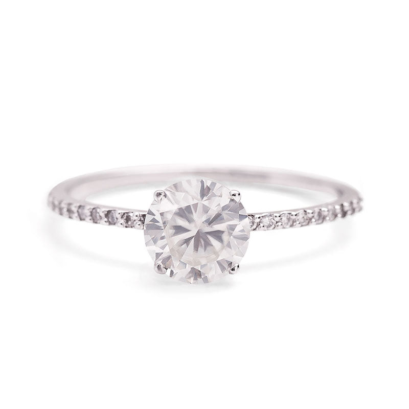 1-Carat Moissanite Ring with 14K solid gold band featuring a 6.5mm excellent quality center stone and 18 conflict-free diamonds.