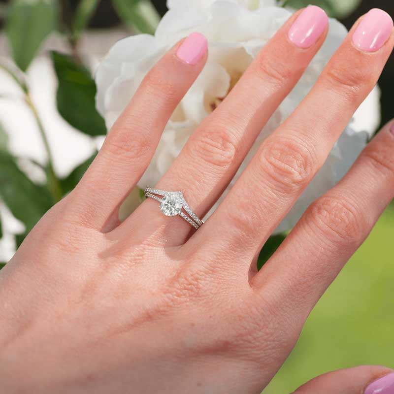 1-Carat Moissanite Ring on hand with 14K solid white gold band and sparkling 1-carat moissanite stone