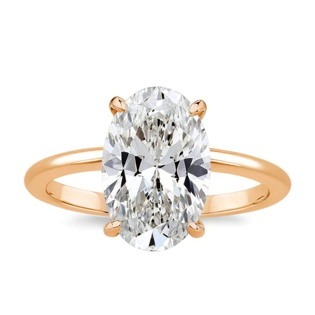 Close-up of oval moissanite engagement ring with 3.5 carat center stone and halo setting-rose gold