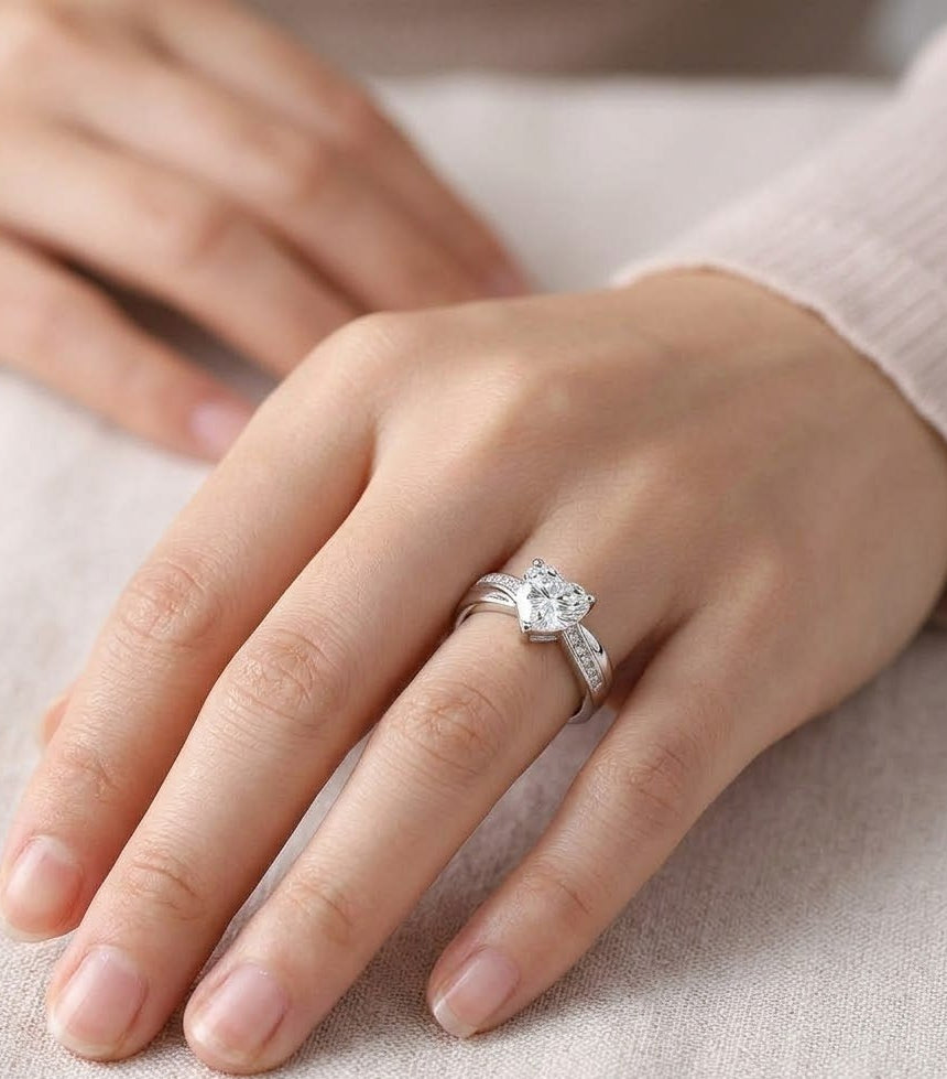 Dainty Sterling Silver Heart Purity Ring with True Love Waits engraving on a hand