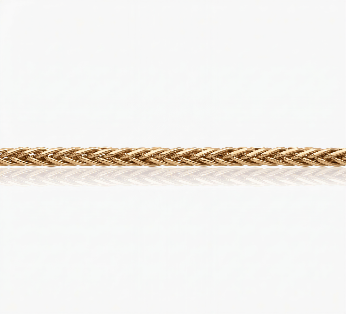 A gold-colored braided necklace or bracelet is shown against a white background.