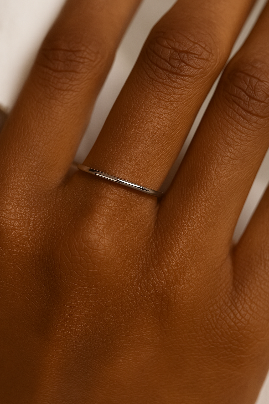 Polished 14K yellow gold thin band on white background-yellow-ring-white-ring-yellow-ring1-on hands
