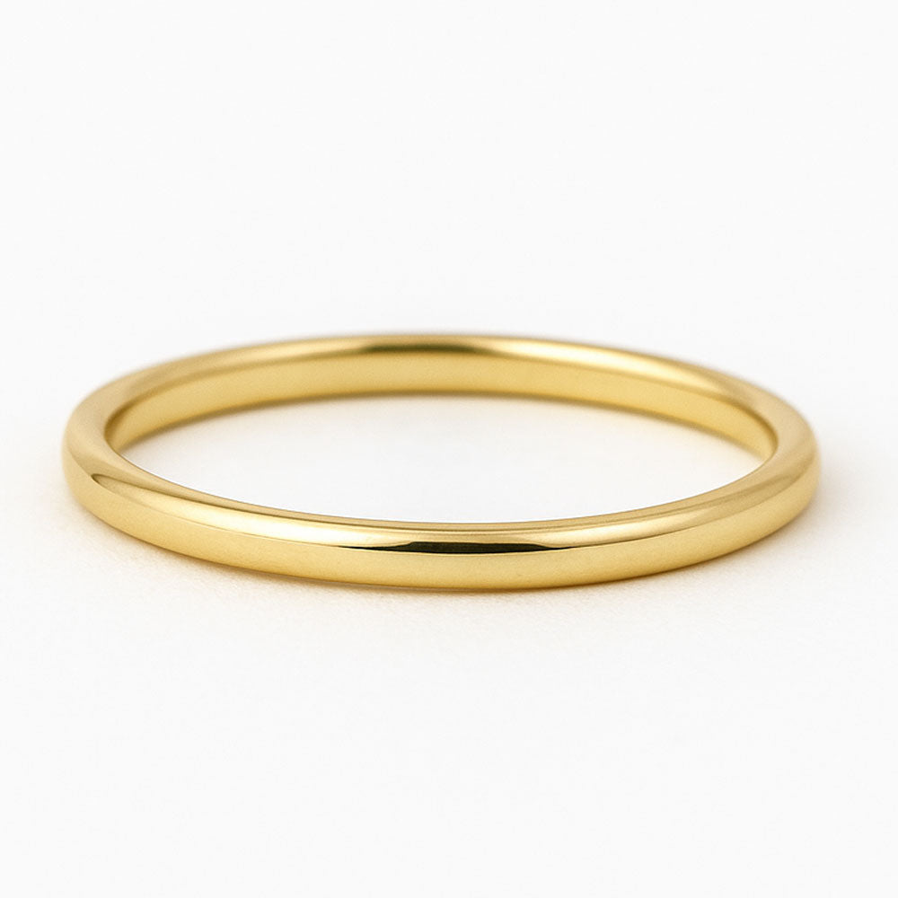 Polished 14K yellow gold thin band on white background-yellow-ring