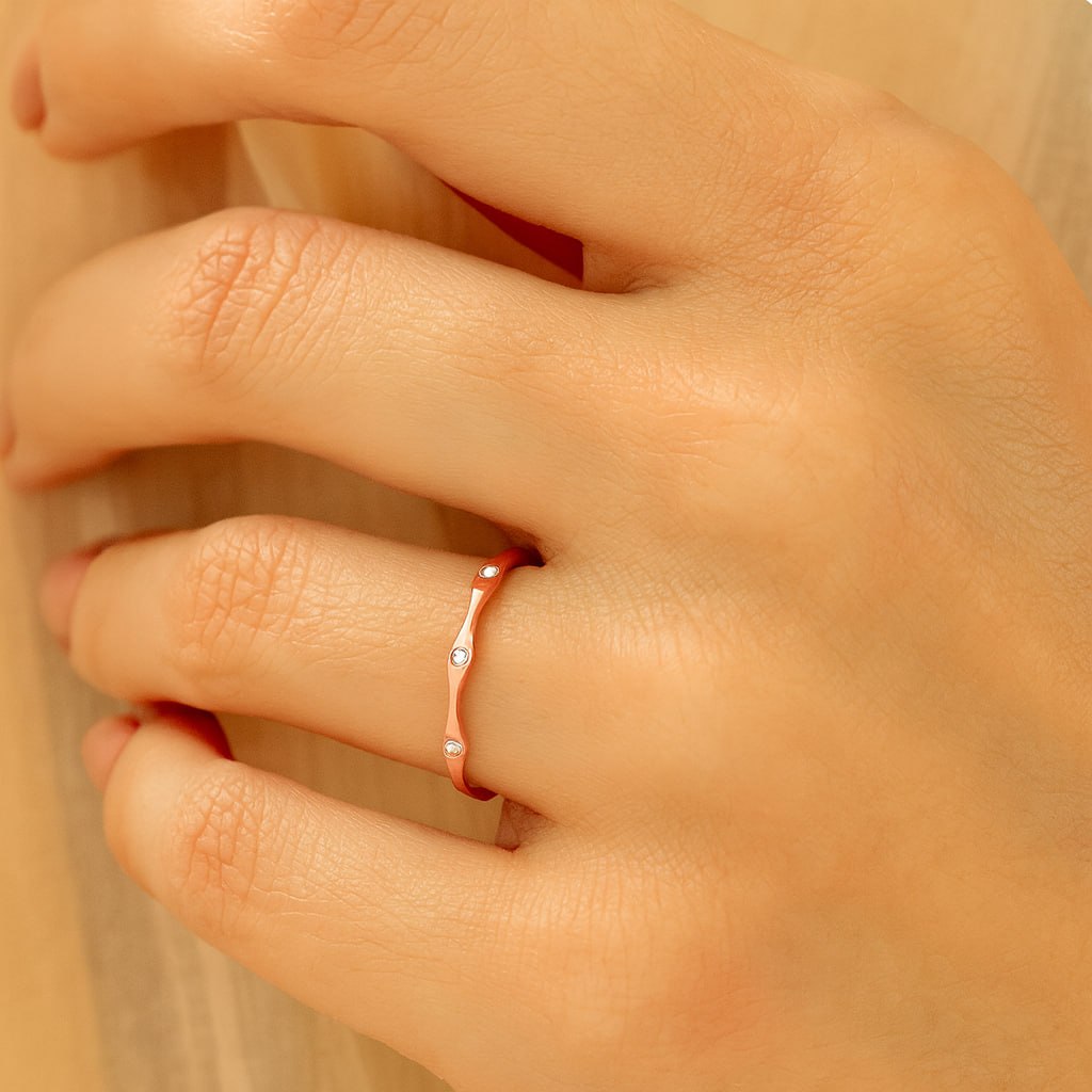 Rose Gold Wavy Band with Moissanites on hand