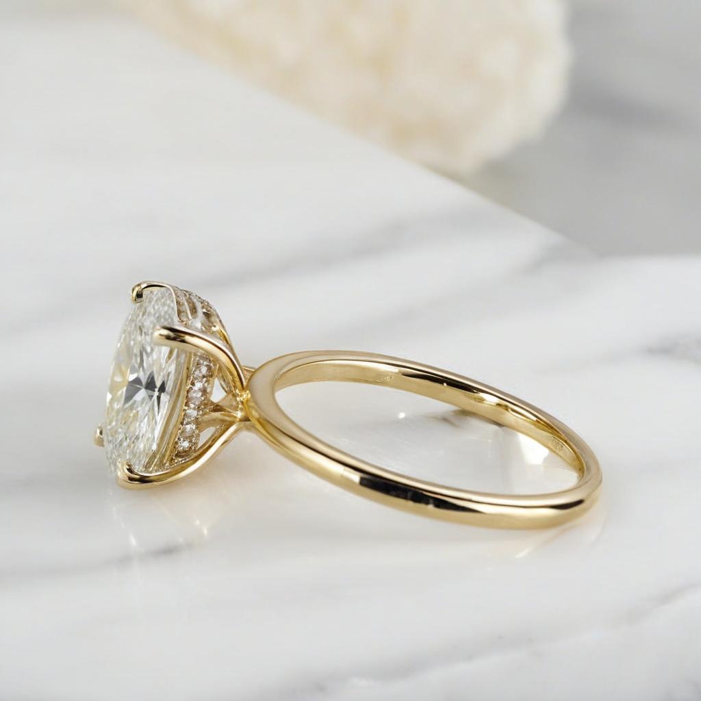 Close-up of oval moissanite engagement ring with 3.5 carat center stone and halo setting-yellow gold