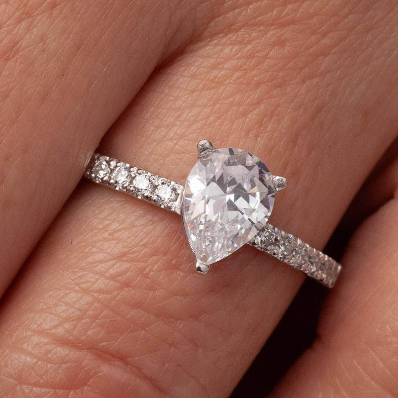 Pear Shaped Moissanite Engagement Ring_photo_one2threejewelry_on_finger